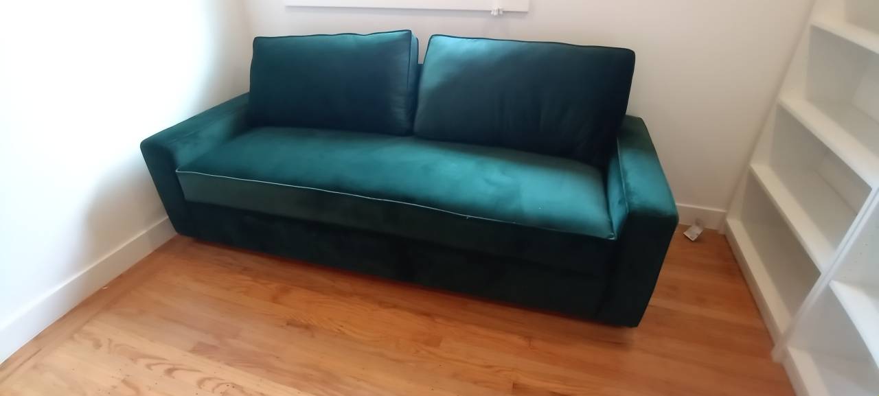 Velvet sleeper sofa dismantled, carried upstairs through a tight entryway, and fully reassembled inside the customer's home by Couch Surgeon