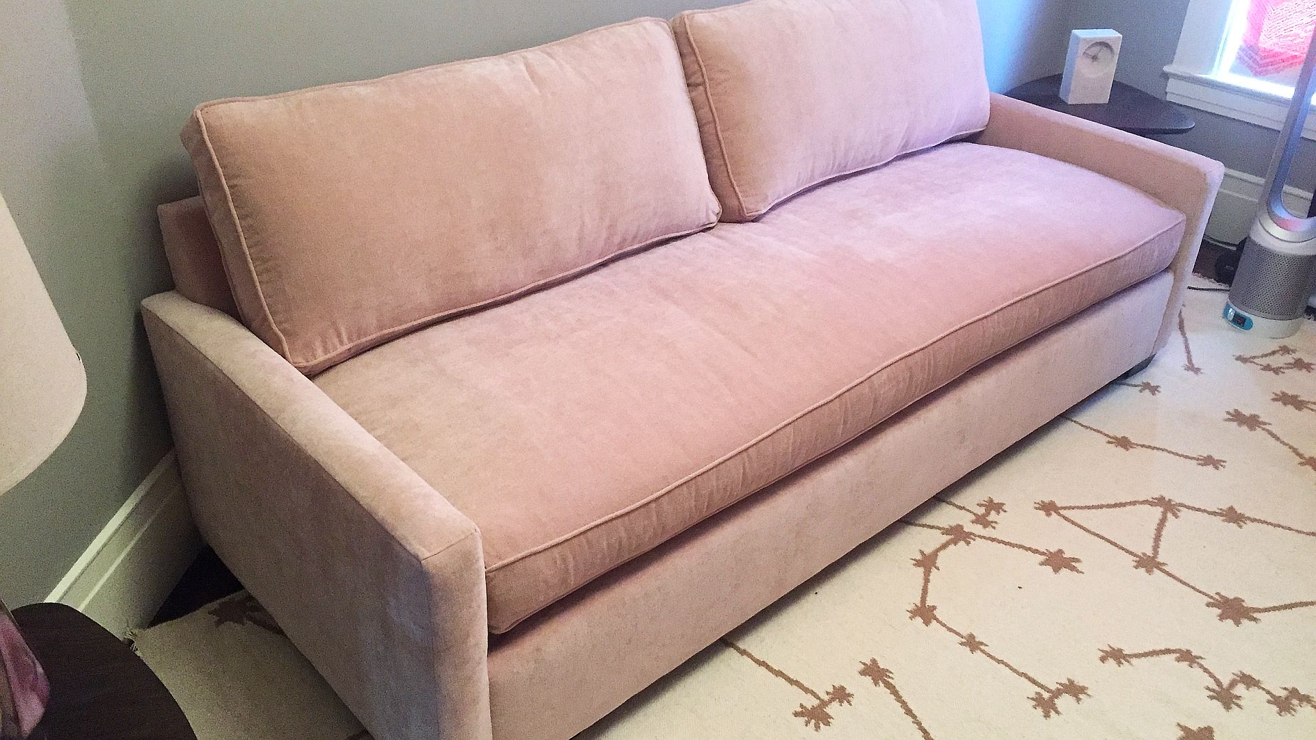 Pink cloud sofa with sleeper disassembled, moved safely upstairs, and professionally reassembled inside the customer's room by Couch Surgeon